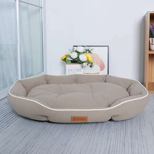 Large beige pet sofa sleeping bed with cozy padding for dogs and cats in modern room setting