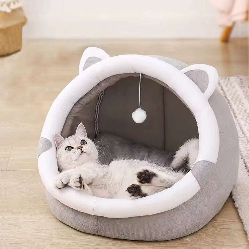 Gray and white foldable Pet Tent Cave Bed with cat ears, featuring a hanging pom-pom toy and a relaxed white cat inside