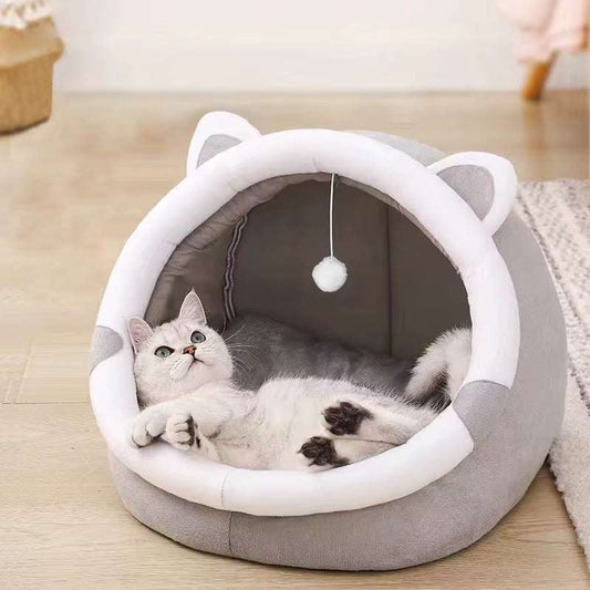 Gray and white foldable Pet Tent Cave Bed with cat ears, featuring a hanging pom-pom toy and a relaxed white cat inside